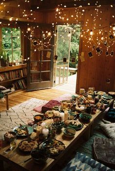 a living room filled with lots of food and candles