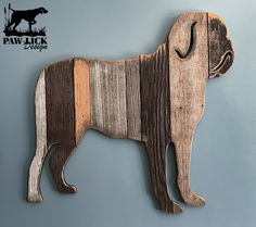 a wooden cutout of a dog on a wall