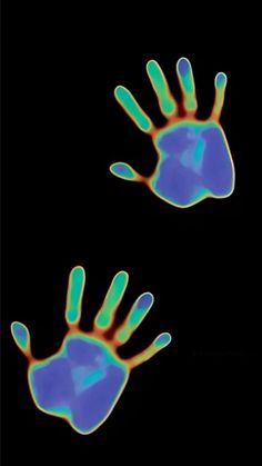 two blue and green hand prints against a black background