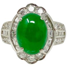 This classic and elegant ring by Moguldiam Inc is custom hand made in platinum. GIA Certified Oval Jade Cabochon weight : 2.74 carat Color : Mottled Green White Diamond weight : 0.70 carat ( GH color and VS clarity) Ring Size : 4 1/2 and can be resized. Metal : Platinum Yellow Gold Cocktail Ring, Edwardian Engagement Ring, Platinum Diamond Rings, White Diamond Ring, Gold Cocktail Ring, Diamond Cocktail Rings, Yellow Gold Setting, Ding Dong, Modern Ring