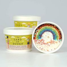 two tubs of land dough with rainbow sprinkles