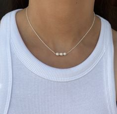 Natural freshwater pearl Sterling Silver Necklace, Freshwater Pearl Jewellery, Pearl Birthstone Gift, Boho Necklace, Dainty Necklace, Dainty Jewellery, Wedding Necklace  This choker necklace is shown in a 14 inch version in the photographs, however the model is a petite size 6 (UK). Please consider different people will require different lengths for the same desired fit. If you are unsure, an extender chain can be added so you have more choice over the length.  I do not accept returns on this necklace as each necklace is custom made to the length ordered. Therefore, please order the necklace length right for you, rather than basing you choice from the pictures.  The June birthstone, pearl, has long been a symbol of purity. The ancient Greeks believed that pearls were the hardened tears of Minimal Choker, Dainty Cross Necklace, Jewellery Pearl, Dainty Pearl Necklace, Dainty Jewellery, Pearl Birthstone, Sterling Silver Choker, Jewellery Wedding, Gemstone Choker