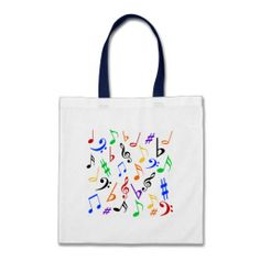 a tote bag with musical notes on the front and sides, all in different colors