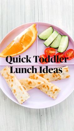 a plate with slices of orange, cucumber and crackers on it