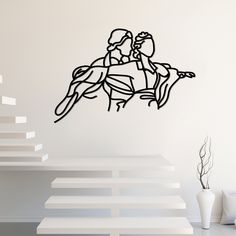 two people riding on the back of a horse wall decal in a living room