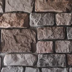 a close up of a stone wall with no mortar