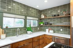 a kitchen with wooden cabinets and white counter tops