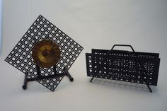 two metal objects sitting next to each other on a table