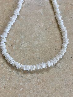 Puca Shell Necklace. White Natural Puca shells from Hawaii. Hand strung on stainless steel wire. Necklace measures 21" in length. Can request length needed in ordering. Prices vary according to length. Adjustable Strand Necklace With Lobster Clasp, Adjustable White Shell Necklace Gift, Adjustable White Shell Necklace For Gift, Nickel-free White Necklace For Beach, Nickel Free White Necklace For Beach, Adjustable White Shell Jewelry, White Strand Necklace With Lobster Clasp, Nickel-free White Necklace With Round Beads, White Nickel-free Necklace With Round Beads