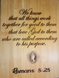 a wooden plaque with the words romans 3 28