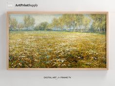 a painting hanging on the wall above a field with wildflowers and trees in it