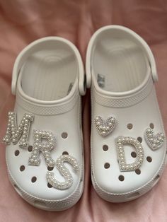 a pair of white shoes with the word mr and mrs on them