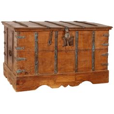 an old wooden chest with metal handles