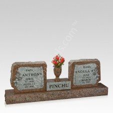 two headstones with flowers on them are placed next to each other