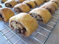 several pastries are cooling on a rack