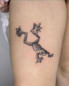 a tattoo on the leg of a woman with an image of a bird flying through the air