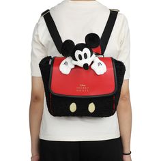 Experience the magic of Disney with the officially licensed Disney Mickey Mouse Peek-A-Boo Convertible Mini Backpack. This delightful mini backpack boasts a unique 3D plush Mickey Mouse design that adds a touch of whimsy to your style. The intricate gold embroidery enhances its charm and elevates its overall appeal. Crafted from soft and cozy faux shearling fabric, it provides a luxurious feel while showcasing your love for Disney's iconic character. What sets this mini backpack apart is its ver Disney Mickey Mouse Backpack, Disney Mickey Mouse Standard Backpack, Disney Icon, Mickey Mouse Bag, Disney+ Icon, Mickey Mouse Design, Oversized Puffer, Disney Park, Mickey Mouse And Friends