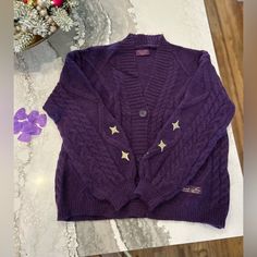 Size Xs/Sm. New In Original Packaging! Includes Purple Heart Confetti. Authentic- Proof Of Purchase Seen In Pictures. Purple Long Sleeve Cable Knit Cardigan, Long Sleeve Purple Cable Knit Cardigan, Purple V-neck Cardigan For Winter, Casual Purple Cable Knit Cardigan, Speak Now Purple, Taylor Swift Purple, Taylor Swift Speak Now, Purple Knit, Heart Confetti