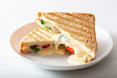 a grilled sandwich on a white plate with the words, veg cheese grilled sandwich only