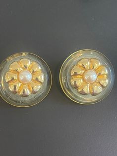 Vintage 1950's Lucite Earrings.  Round with Gold flowers and Pearl center Vintage Gold Flower Clip-on Earrings, Vintage Gold Flower-shaped Earrings, Vintage Gold Flower Shaped Earrings, Vintage Flower-shaped Clip-on Earrings, Vintage Clip-on Flower Earrings, Vintage Flower Clip-on Earrings For Wedding, Vintage Gold Flower Earrings For Party, Vintage Flower Shaped Clip-on Earrings, Vintage Plug Earrings For Party