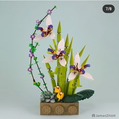 an arrangement of flowers in a wooden vase