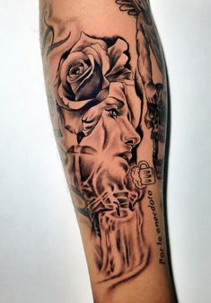 a man's arm with a rose and skull tattoo on it