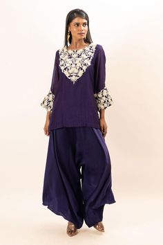 Purple kurta with floral embroidered yoke and cuffs. Paired with a japanese pant.
Components: 2
Pattern: Embroidery
Type Of Work: Floral
Neckline: Round Neck
Sleeve Type: Full Sleeves
Fabric: Kurta: Chanderi, Pant: Modal Satin, Lining: Mul Cotton
Color: Purple
Other Details: 
Attached inner lining
Closure: Elastic
Occasion: Sangeet - Aza Fashions Japanese Pants, Pant For Women, Embroidery Floral, Pattern Embroidery, Full Sleeves, Purple Floral, Aza Fashion, Fashion Set, Full Sleeve