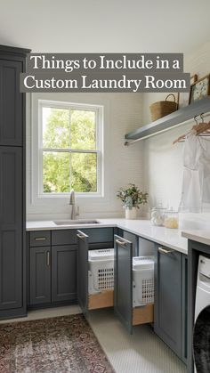 a washer and dryer in a small kitchen with gray cabinets, white counter tops and drawers