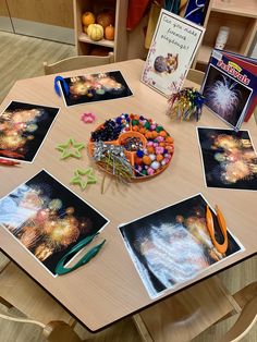 the table is set up with pictures and craft supplies for children to use on their crafts