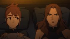 two anime characters are sitting on the couch with their heads turned to look like they're looking at something