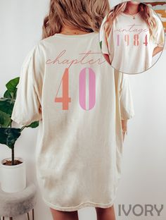 "Classic 1984 Shirts For Women, Vintage 40th Birthday Year Number Tshirt For Him, 40th Milestone Best Friend Bday Gift For Her, 40 Bday Shirt HOW TO ORDER ➀ Select color ➁ Select the size (Please check size chart) ✦ True to size. Size up 1-2 sizes for an oversized look. ➂ Add to cart ✦ (Optional) \"Add message to Seller\" on the checkout page. GARMENT FEATURES ✦ Crew neckline ✦ Direct to garment printing - no vinyl, decal, or iron-on technique ✦ Our designs are printed on the garment to last a long time and may not appear as 'glossy' or saturated as iron-on designs are. ✦ Please note that colors may appear different on different digital screens and may not be a true representation of the actual colors. ✦ Additional T-Shirt Colors and Sizes Available Upon Request ✧✧Brands: Bella Canvas Unis Vintage 40th Birthday, Summer Birthday Outfits, 1984 Shirt, Bday Shirt, Bday Gift, Garment Industry, Birthday Tshirts, Shirts For Women, Women Vintage