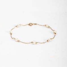 14K Real Gold Freshwater Pearl Station Bracelet, 4.50-5.00 mm Simple Pearl Gold Bead Bracelet, Dainty Pearl Chain Bracelet, Bridesmaid Gift White pearls symbolize innocence, beauty, sincerity, and new beginnings. This is what makes the white pearl a true classic for bridal jewelry. It's the most common pearl that you'll see used in any sort of jewelry today. Not only are pearl engagement rings an eye-catching look, but they also have a special meaning connected with them. It's been said that pearls symbolize wisdom, integrity, and loyalty, all of which are important in your relationship with your partner. ⚠ We would like to inform you that the number of pearls may vary according to the bracelet length. The length of bracelet in the listing is 7.0 inches. 📘 D E T A I L S  * Solid Gold (rea Gold Bead Bracelet, Station Bracelet, Pearl Engagement Ring, Simple Pearl, Bracelet Dainty, Gold Bead Bracelets, Pearl Chain, Pearl Size, White Pearl