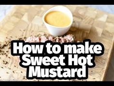 the words how to make sweet hot mustard on a cutting board next to a cup of coffee