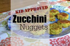 zucchini nuggets on a plate with ketchup in the background