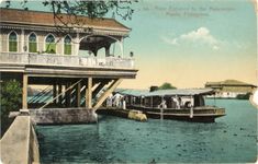 an old postcard shows a house on the water