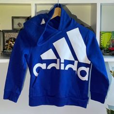 Nwot! Adidas Blue/White Logo Hooded Sweatshirt. Pullover. Never Been Worn! Boys Size 8. Super Soft. Beautiful Color. Adidas White Hooded Top, White Adidas Hooded Top, White Adidas Hoodie, White Adidas Hoodie Tops, White Hooded Adidas Top, Adidas Hooded Sportswear Top, Adidas Sportswear Hooded Top, Blue Sports Top With Adjustable Hood, Blue Adidas Sportswear Hoodie