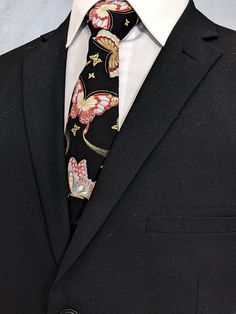 "This black Asian butterfly tie features a black background with allover butterfly pattern. Colors include shades of reds, blues, golds, yellows and black. This Necktie with Butterfly is available as a skinny necktie and an extra-long tie. Pocket Square available upon request pending available of fabric cost $10.99 Convo me to check availability. Expertly hand-made from 100% cotton you can select your length from 57\" to 71\" (Great for taller Men). Width is standard 3.5\" as shown here or skinn Business Tie With Butterfly Knot, Tailored Black Suit And Tie Accessories For Party, Black Summer Business Ties, Black Summer Formal Ties, Elegant Black Summer Ties, Fitted Business Ties With Butterfly Knot, Classic Black Ties, Black Ties For Spring, Black Tie For Spring