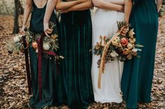 four bridesmaids in long green dresses standing next to each other