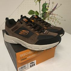 Men's Skechers Relaxed Fit Oak Canyon Walking Sneaker Relaxed Fit Design For A Roomy And Comfortable Fit Tough Synthetic Overlays At Toe And Heel Mesh Fabric Front And Side Panels For Cooling Effect Stabilizing Heel And Side Panels Padded Collar And Tongue Memory Foam Cushioned Comfort Insole Well-Cushioned Flexible Shock-Absorbing Midsole Stabilized Supportive Athletic Midsole Design Stabilized Midfoot Panel High-Traction Rubber Flexible Outsole Heel Pull Tab For Easy On And Off Brown Lace-up Sneakers With Reinforced Toe, Brown Walking Shoes With Laces For Streetwear, Brown Laced Walking Shoes For Streetwear, Brown Streetwear Walking Shoes With Laces, Brown Low-top Slip-resistant Sneakers, Brown Lace-up Synthetic Walking Shoes, Brown Synthetic Lace-up Walking Shoes, Fade-resistant Brown Sneakers For Walking, Brown Fade-resistant Sneakers With Round Toe