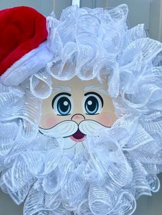 a christmas wreath with a santa hat on it