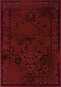 a red rug with an ornate design on the center and bottom corner, in front of a