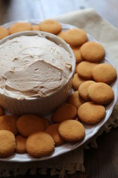 a white plate topped with cookies and a dip