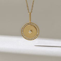 Minimalist Medallion Pendant Necklace for Women Features * Made to Order. * Gold KT: 14KT * Custom Gold Color: Yellow Gold * Charm 21.19mm x 13.72mm * Charm Thickness: 1.03mm * Diamond Color-Clarity: D-E-F color VVS clarity (excellent ideal cut) * Total Ctw: 0.32 ctw * Ready to Ship in 5-7 Business Days ✓ We care about the environment,the jewelry we cast is made with recycled gold. We source exclusively post-consumer material that is refined back to their pure elements to ensure that the gold is Pendant Designs, Medallion Necklace, Necklace Unique, Disc Pendant, Charm Pendant Necklace, Gold Necklace Layered, Recycled Gold, Diamond Pendant Necklace, Pendant Design