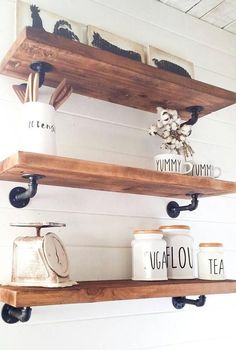 two wooden shelves with coffee mugs and tea cups on them, hanging from the ceiling