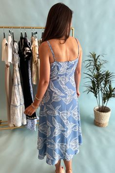 Slip into effortless style with our Light Blue Botanical Print Dress! The silky material and adjustable straps provide a comfortable fit while the deep v-neck and midi length add a touch of sophistication. This dress offers a playful twist on a classic floral design. Model is wearing a size small. Stocked at Arlington Village. V-neck Midi Dress With Tie Straps For Vacation, Blue Summer Midi Dress With Tie Straps, Breezy Midi Dress With Spaghetti Straps, Breezy Spaghetti Strap Midi Dress For Day Out, Blue Breezy Sundress With Spaghetti Straps, Blue Midi Dress With Tie Straps For Vacation, Blue Midi Dress With Adjustable Straps For Day Out, Blue Midi Dress With Tie Straps For Day Out, Flowy V-neck Dress With Adjustable Straps