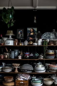 a shelf filled with lots of plates and bowls