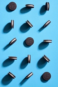 oreo cookies and oreos are arranged on a blue surface