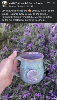 someone is holding a mug in front of some purple flowers and lavenders, with the caption'i love how she turned out x3 on the outside