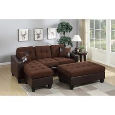 a living room scene with focus on the couch and ottoman