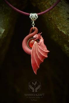 *Embrace fantasy and elegance with this Dragon necklace in pink and red hues. This handmade polymer clay pendant captures the spirit of dragons and is a perfect gift for fantasy lovers, Renaissance Faire enthusiasts or anyone who adores the allure of mythical realms. 🏰Embark on a journey into the realm of enchantment with this dragon necklace in pink and red tones! This beautiful dragon pendant will serve you not just as an accessory, but as a wise guardian and spirit companion! 🔮The fusion of pink and red hues symbolizes a fusion of passions and desires that transcend the boundaries of ordinary existence. In the world of magic, this combination  represents the alchemical reaction of emotions, merging the fiery ardor of red with the tender devotion of pink. This fusion embodies the spect Fantasy Polymer Clay Jewelry As A Gift, Fantasy Dragon Design Necklace, Whimsical Pink Polymer Clay Jewelry, Handmade Pink Fantasy Jewelry, Handmade Polymer Clay Jewelry In Fantasy Style, Handmade Red Necklaces For Collectors, Red Polymer Clay Necklace For Gift, Red Handmade Necklace For Collectors, Unique Red Necklace For Collectors